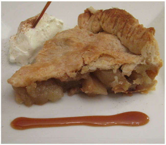 Cinnamon apple pie with a Bailey's caramel sauce, vanilla ice cream, and maple syrup caramel.