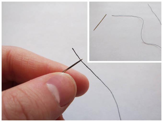 Threading a needle with black thread