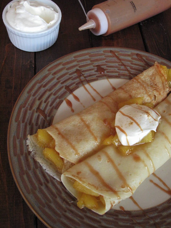 Pineapple-ginger crepes with whipped cream and caramel