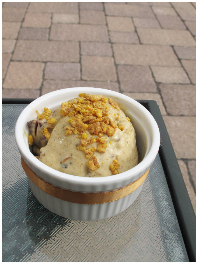 Grilled peach ice cream with chunks of frozen peach and cinnamon crumble
