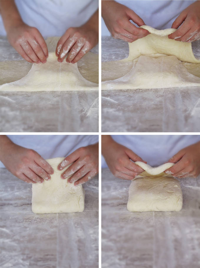 Folding the detrempe (puff pastry or croissant dough) over the beurrage (butter and flour block)