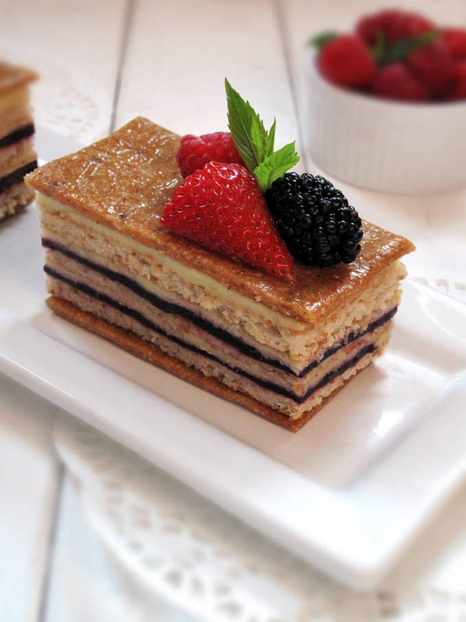 Raspberry hazelnut torte with vanilla-chive pastry cream, hazelnut dacquoise, and hazelnut nougatine