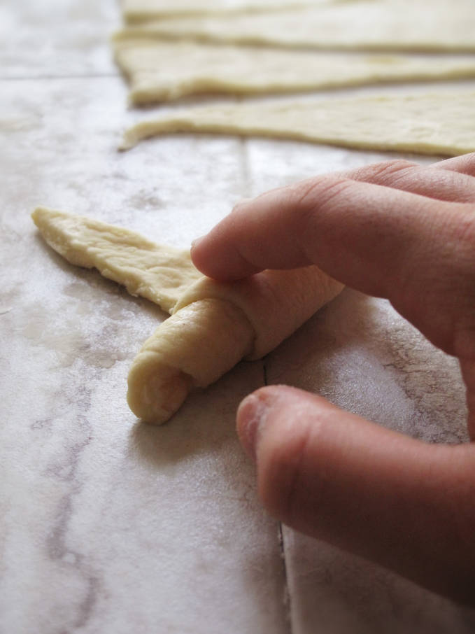 Rolling up croissant dough