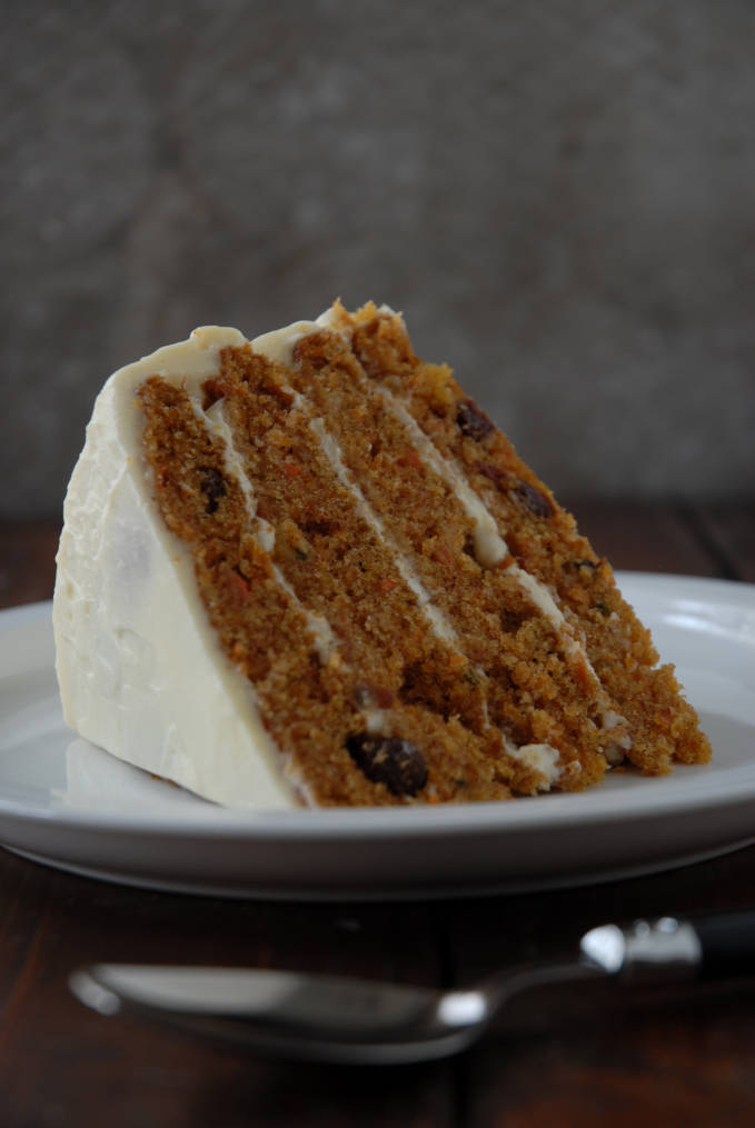 Carrot cake with pineapple chunks and raisins, coated in cream cheese frosting. Folks, this is the BEST CARROT CAKE EVER. Click for the recipe!