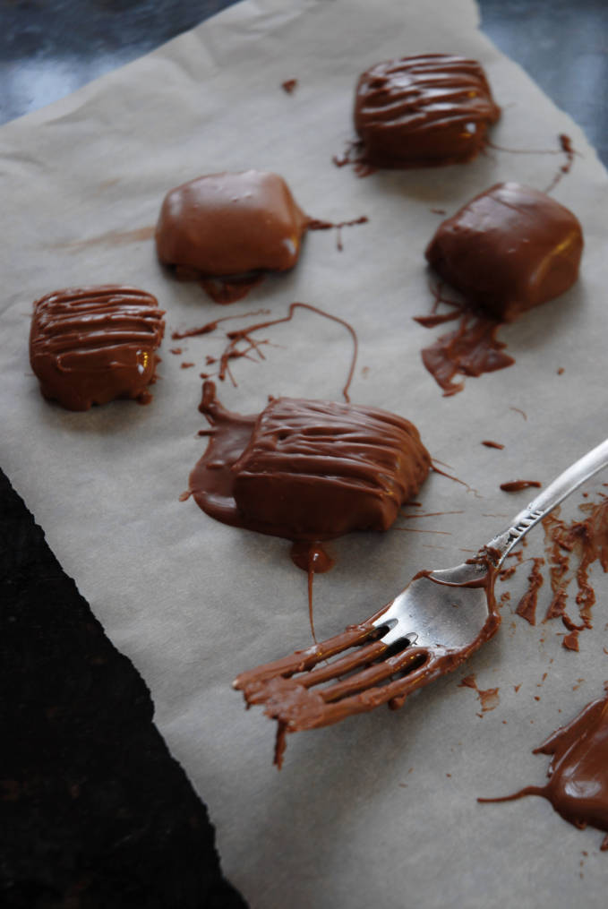 Homemade Mars bars right after being dipped in milk chocolate