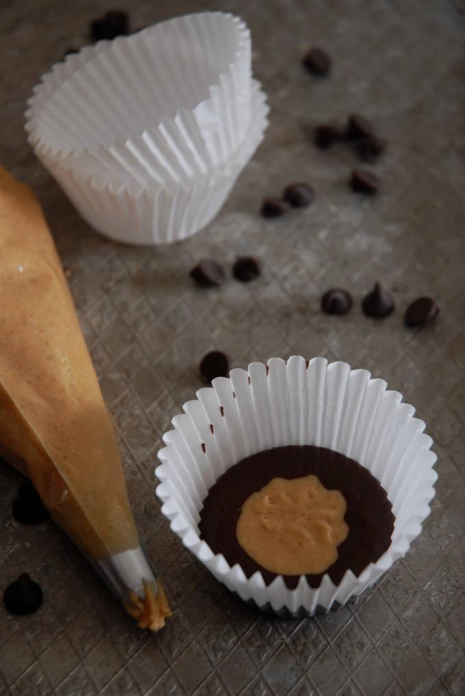 Adding peanut butter to homemade peanut butter cups. Click for the recipe!