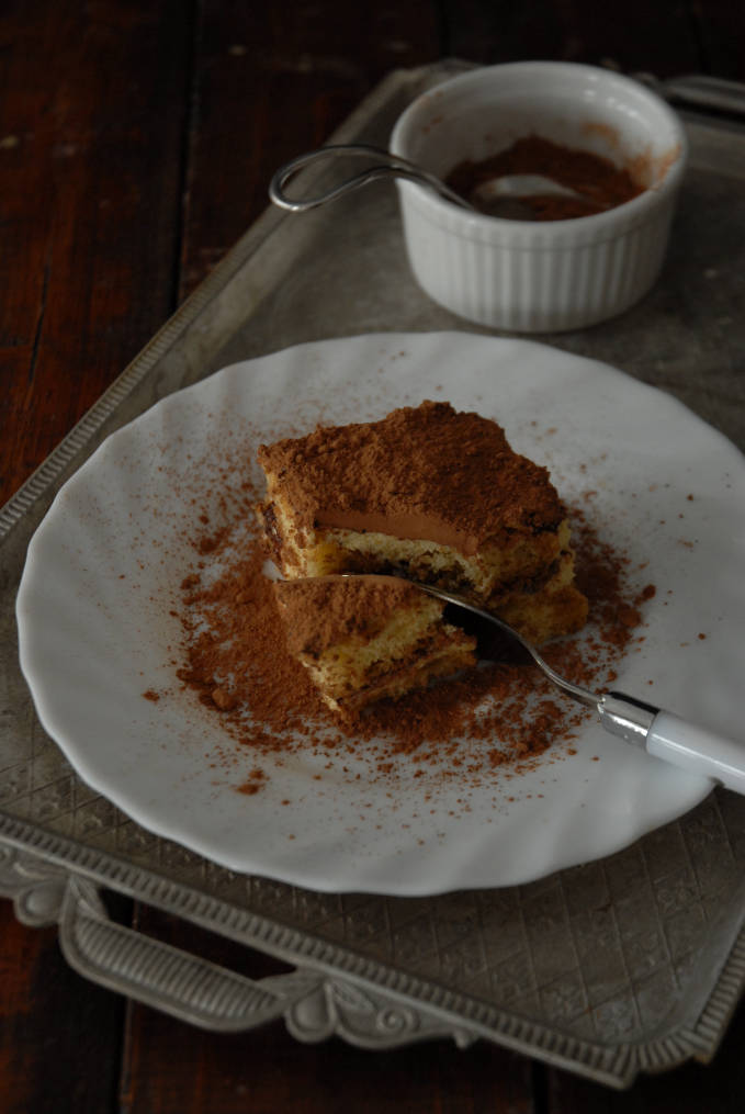 Homemade tiramisu dusted with cocoa powder. Make your own! Click to get the recipe.