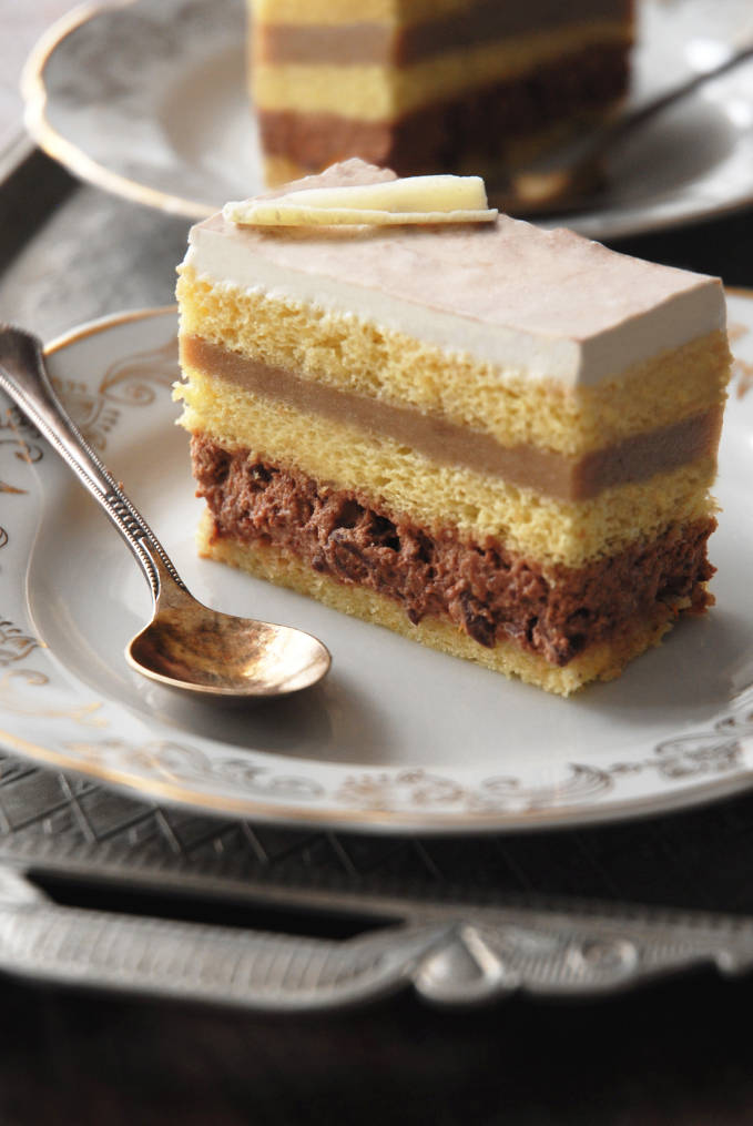 B-Caraibe cake with hazelnut-almond joconde, chocolate-orange chantilly cream, banana cream, and vanilla chantilly. EASIER to make than it looks. Click to get the recipe!