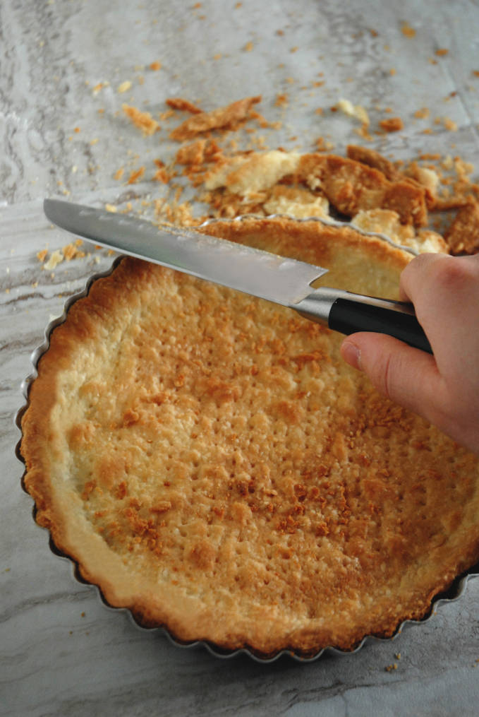 Cutting tart dough with a sharp knife while it's warm helps with straight edges--click to get instructions on how to make PERFECT PIE & TART DOUGH every time!