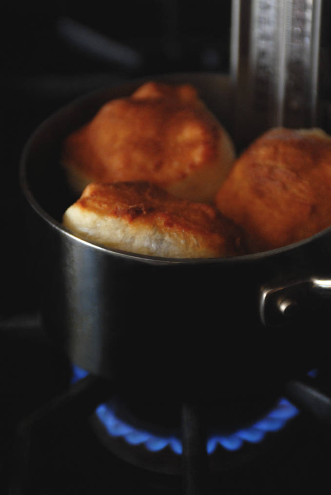 Frying buttermilk beignets. They're super simple to make, and if you click to get the recipe you can eat 'em tonight!