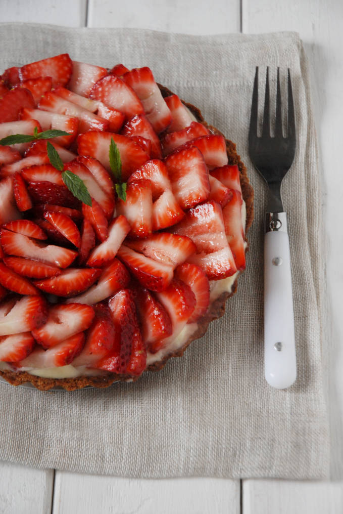 Strawberry tart with vanilla pastry cream, white chocolate, and a lemon glaze--click to get instructions on how to make PERFECT PIE & TART DOUGH every time!