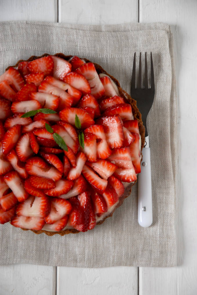 Strawberry tart with vanilla pastry cream, white chocolate, and a lemon glaze--click to get instructions on how to make PERFECT PIE & TART DOUGH every time!