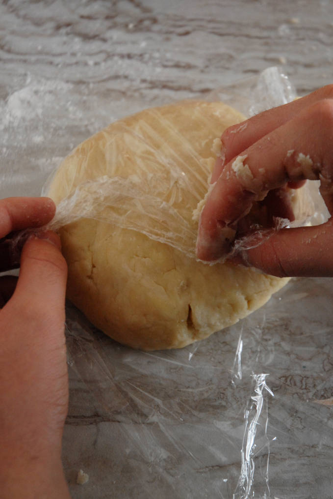Wrapping up tart dough in plastic wrap--click to get instructions on how to make PERFECT PIE & TART DOUGH every time!