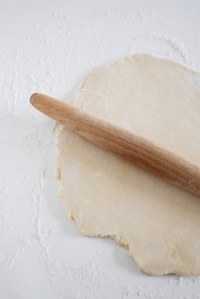 Rolling out pie dough some more--click to get a step-by-step photo tutorial on lattice pie crusts, so you can make them easily!