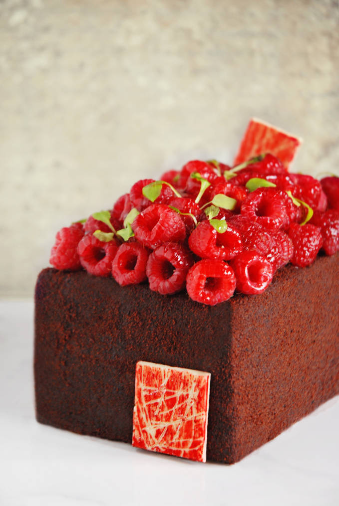 Sinful dark chocolate devil's food cake with raspberries. Click for the AMAZING recipe!