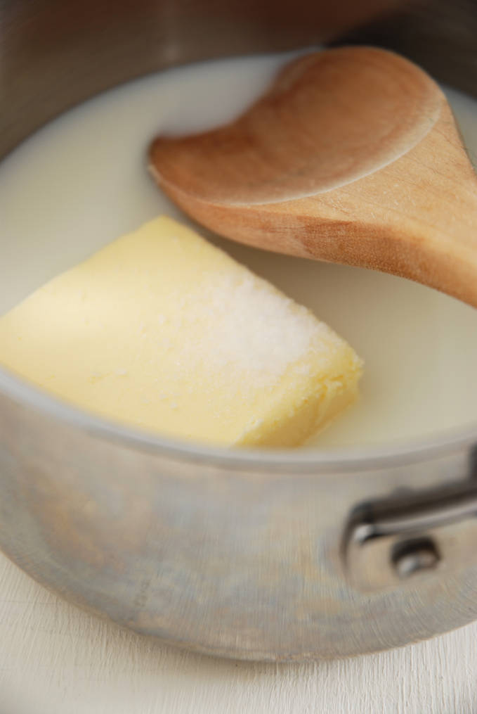 Breaking down the perfect éclair | Combining butter, milk, water, salt, and sugar in a saucepan to make the perfect choux pastry