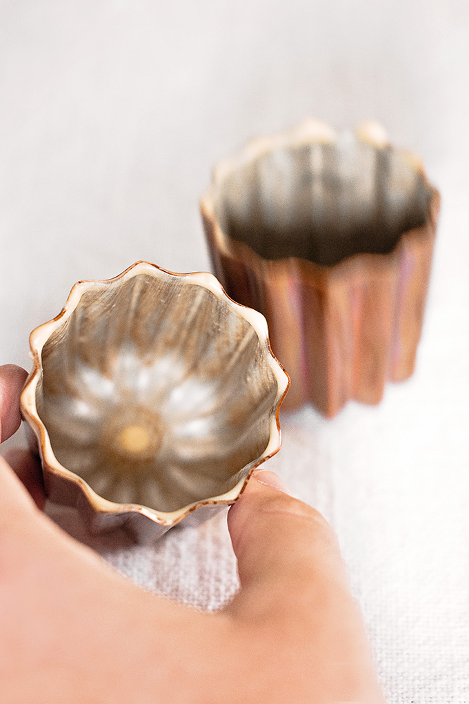 Copper canelé moulds lightly coated with "white oil" beeswax and butter mixture