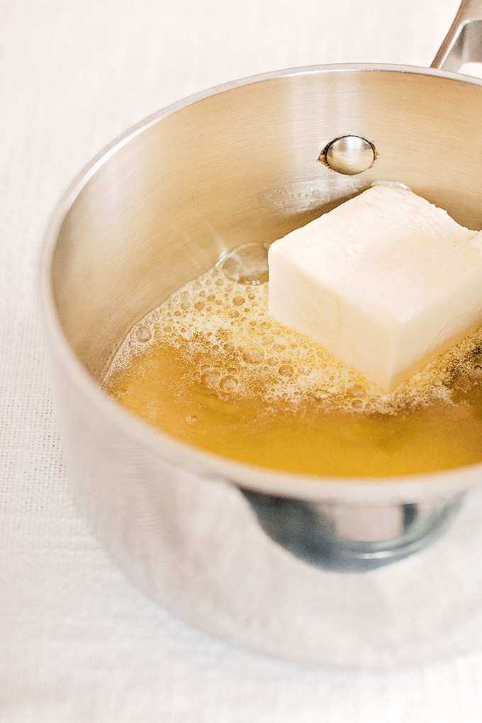 Preparing "white oil" with butter and beeswax for canelés