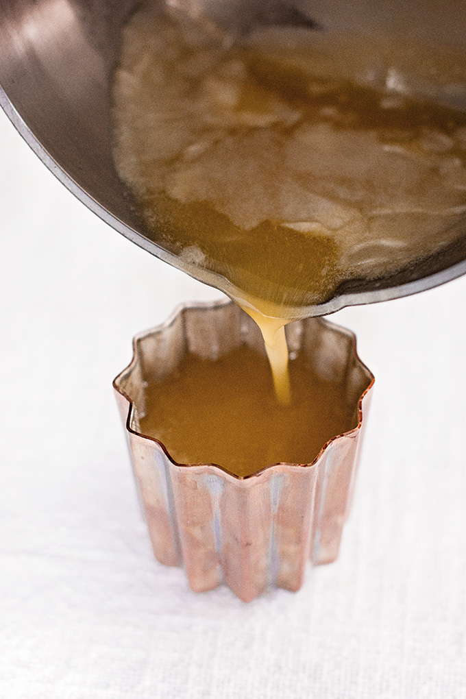 Coating copper canelé moulds with "white oil" beeswax and butter mixture